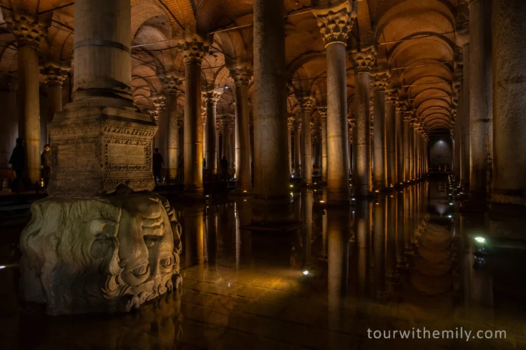 Marble columns rising from shallow water in the dimly lit Basilica Cistern, Istanbul